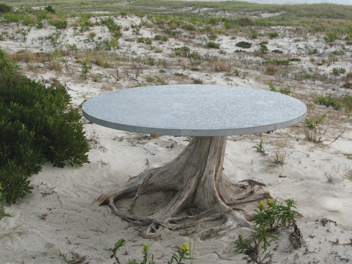 48 inch round zinc table on weathered cedar root base