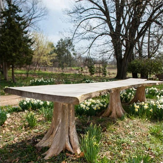 192 inch live edge paulownia table on sculptural cedar root bases